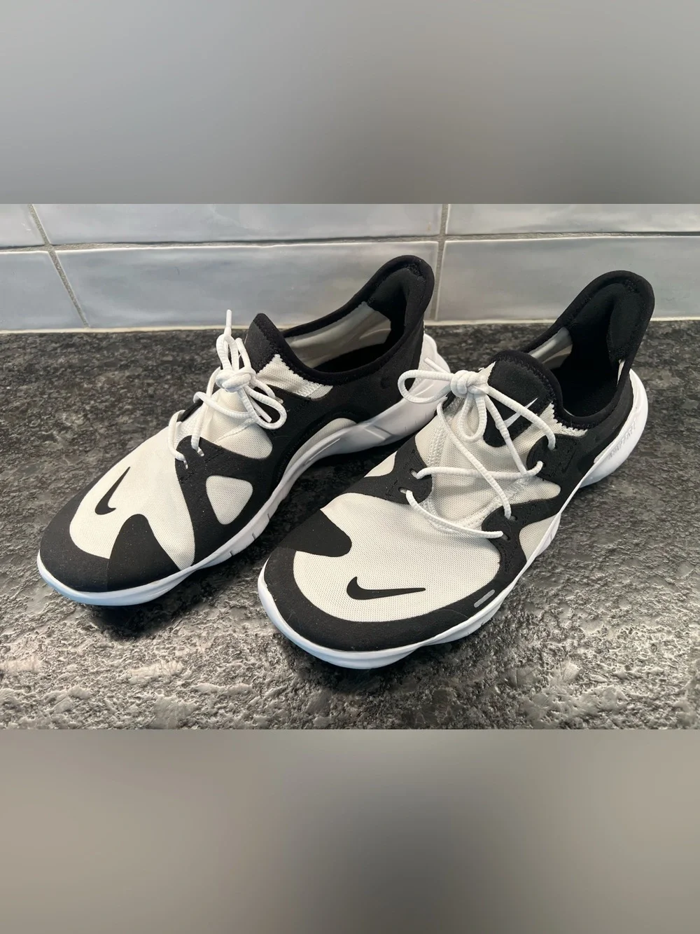 Nike Free brand Black and White Slip-On Performance Sneakers